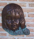 Bronzen beeld Meisjesgezicht  muurdecoratie 40x5x33cm