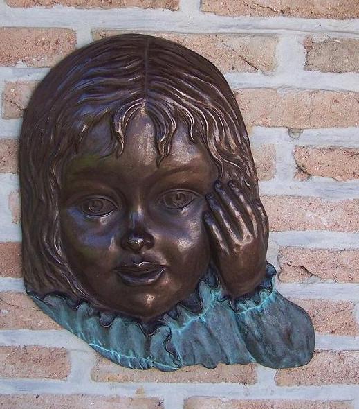 Bronzen beeld Meisjesgezicht  muurdecoratie 40x5x33cm